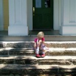 Girl sitting on steps